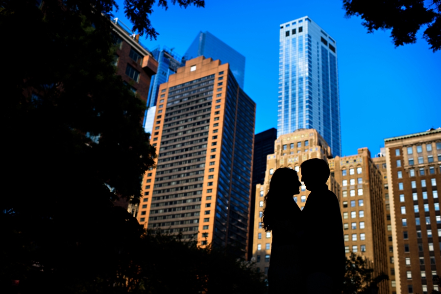 A silhouette of a couple on their engagement session in Battery Park NYC.
